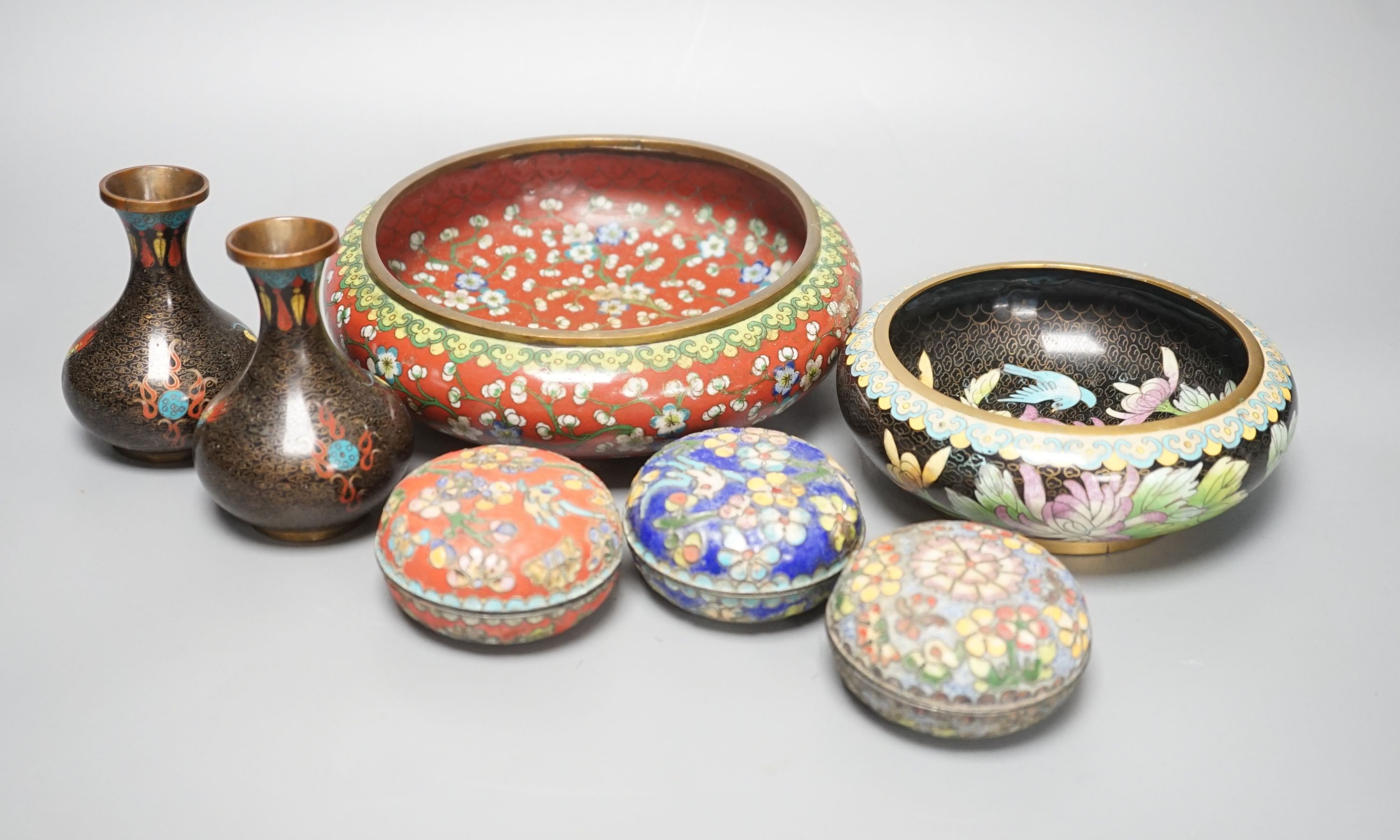 A group of Chinese cloisonné enamel dishes, boxes and a pair of vases, early 20th century and later, largest diameter 17cm